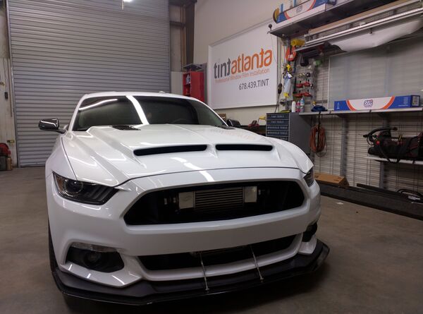 Ford Mustang GT front view showing professional dark window tint by tintsaltlake